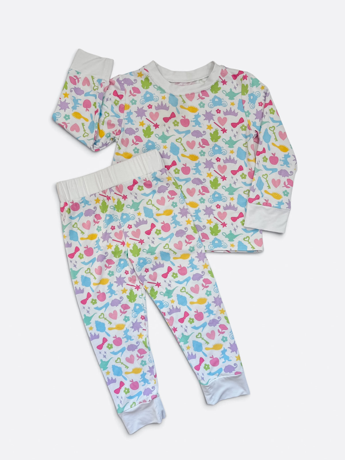 Polly & Pearl girls bamboo pajama set with colorful pastel princess print, long sleeves, matching pants and white cuffs