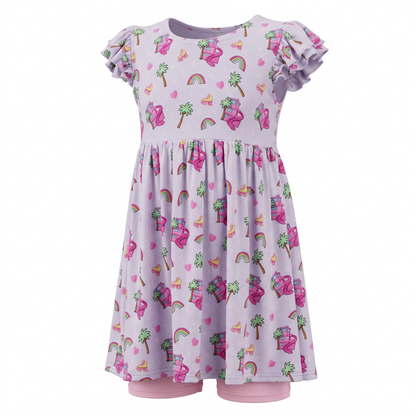 A children's short-sleeve dress in light lavender with a colorful print of rainbows, palm trees, yellow roller-skates, and a doll dream house with matching pink biker shorts 