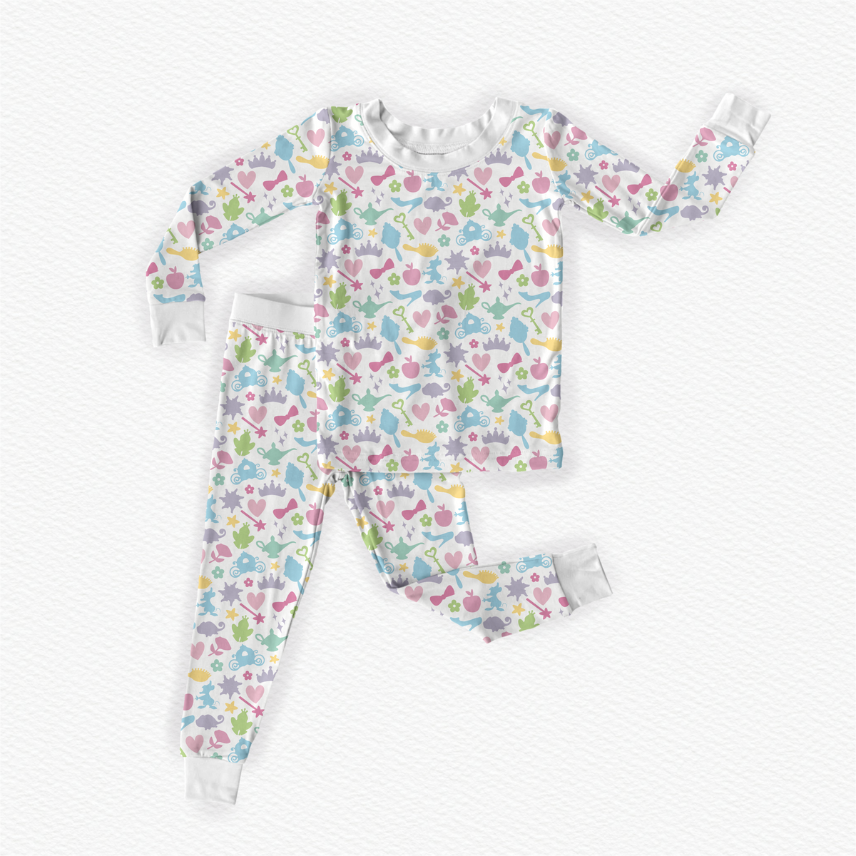 Polly & Pearl girls bamboo pajamas with pastel princess print, long sleeve top, matching pants and white ribbed cuffs