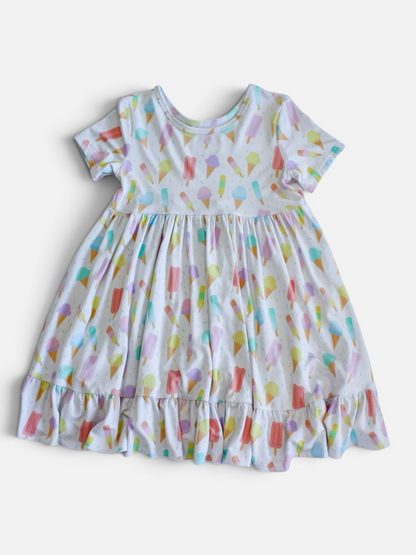 Polly & Pearl short sleeve dress in white with a colorful pastel ice cream cone and popsicle print and ruffled hem.