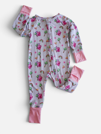 Polly & Pearl footless baby romper with a retro palm tree and rainbow print, featuring a front zipper and pink cuffs.
